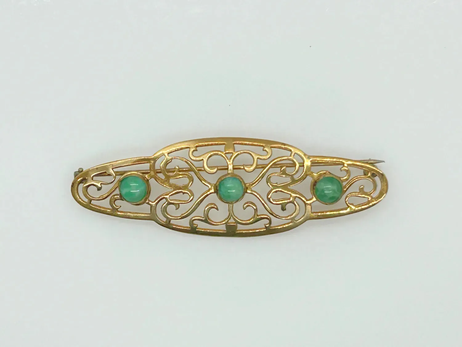 Elegant 1920s Art Deco Brooch with Green Stones