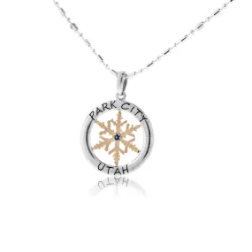 Gold Sapphire Center Snowflake in Sterling Silver Circle