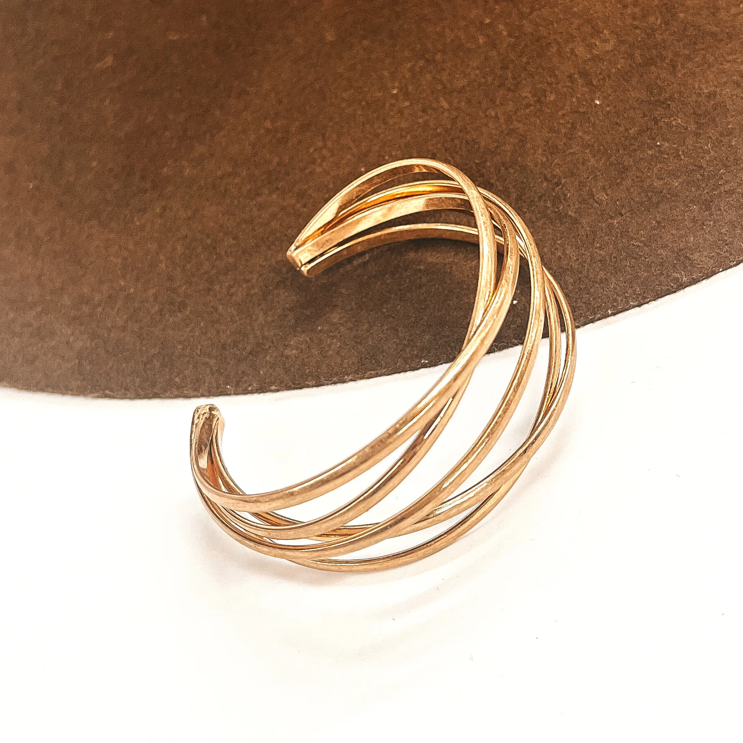 Made In The Shade Interwined Metal Cuff Bracelet in Gold Tone