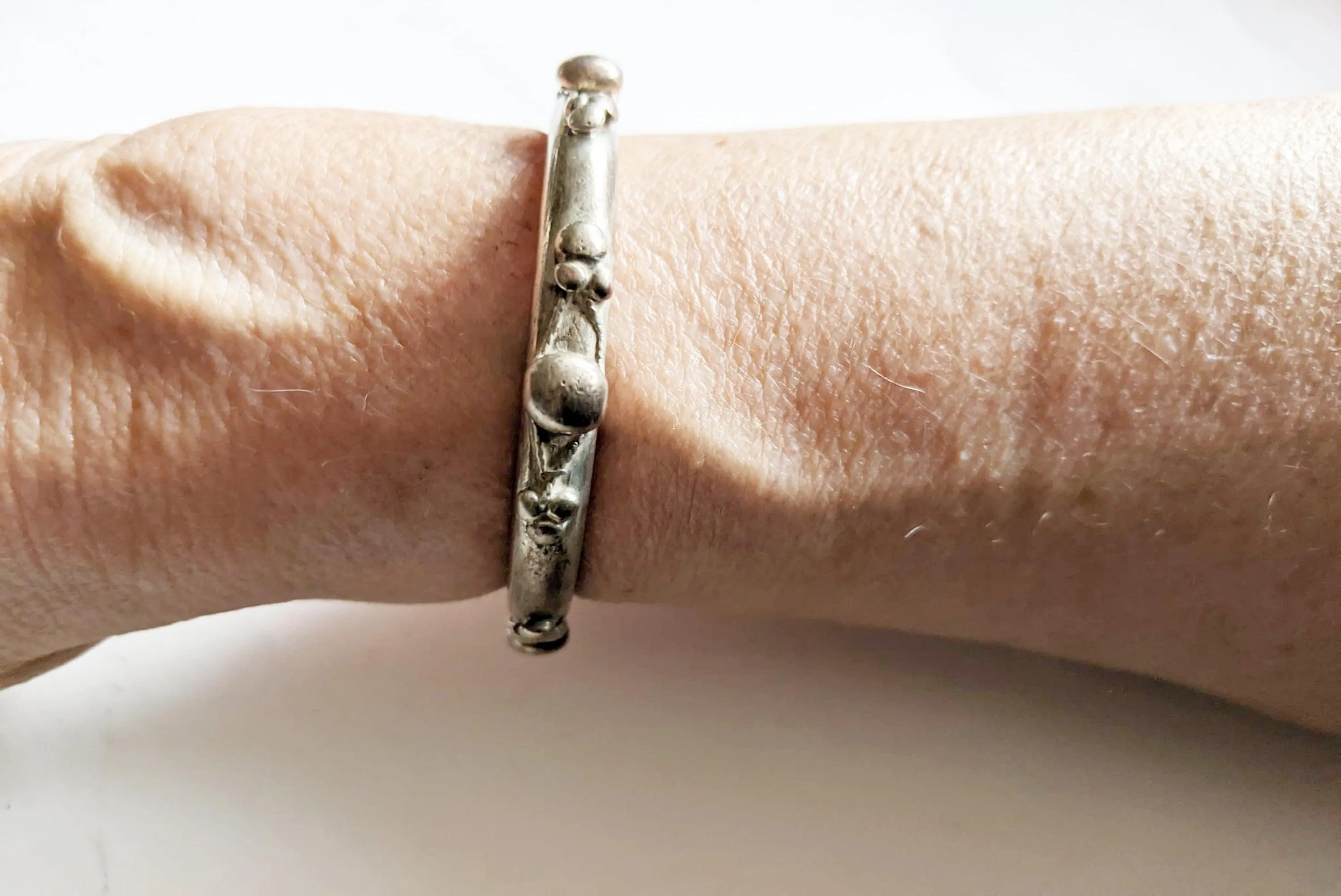 Single Tier Silver Currency Nubian Bracelet