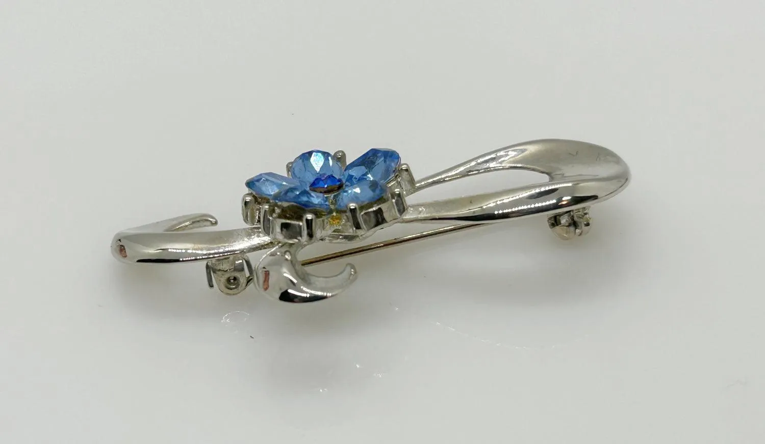 Vintage Silver Bow Brooch with Blue Stones