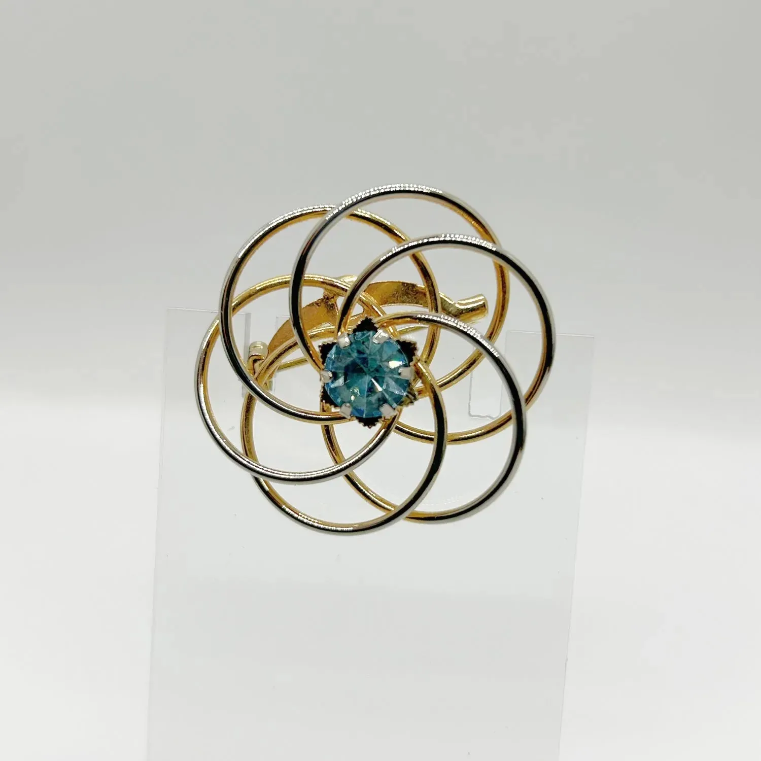 Vintage Swirl Brooch with Blue Rhinestone Center