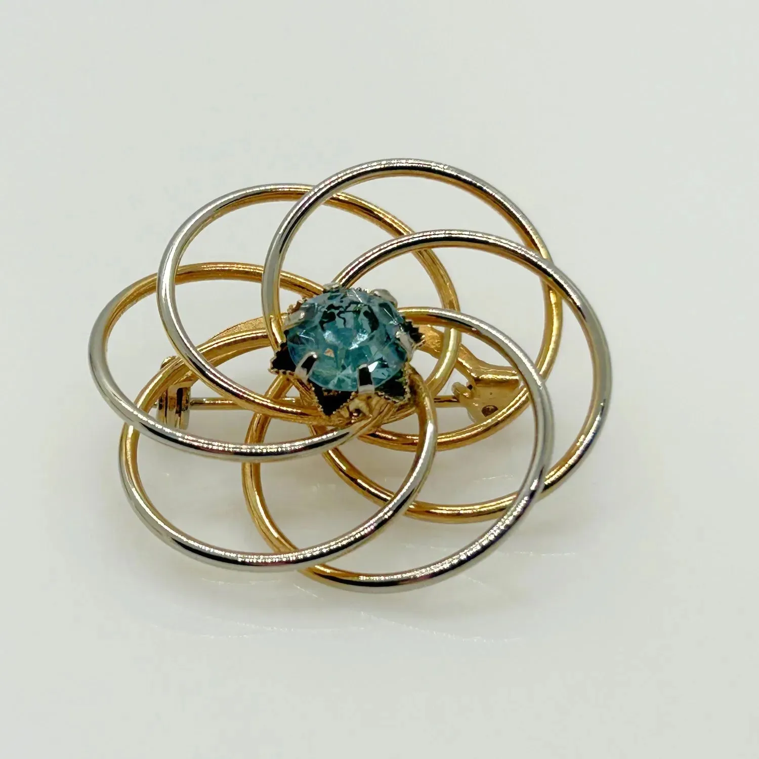 Vintage Swirl Brooch with Blue Rhinestone Center