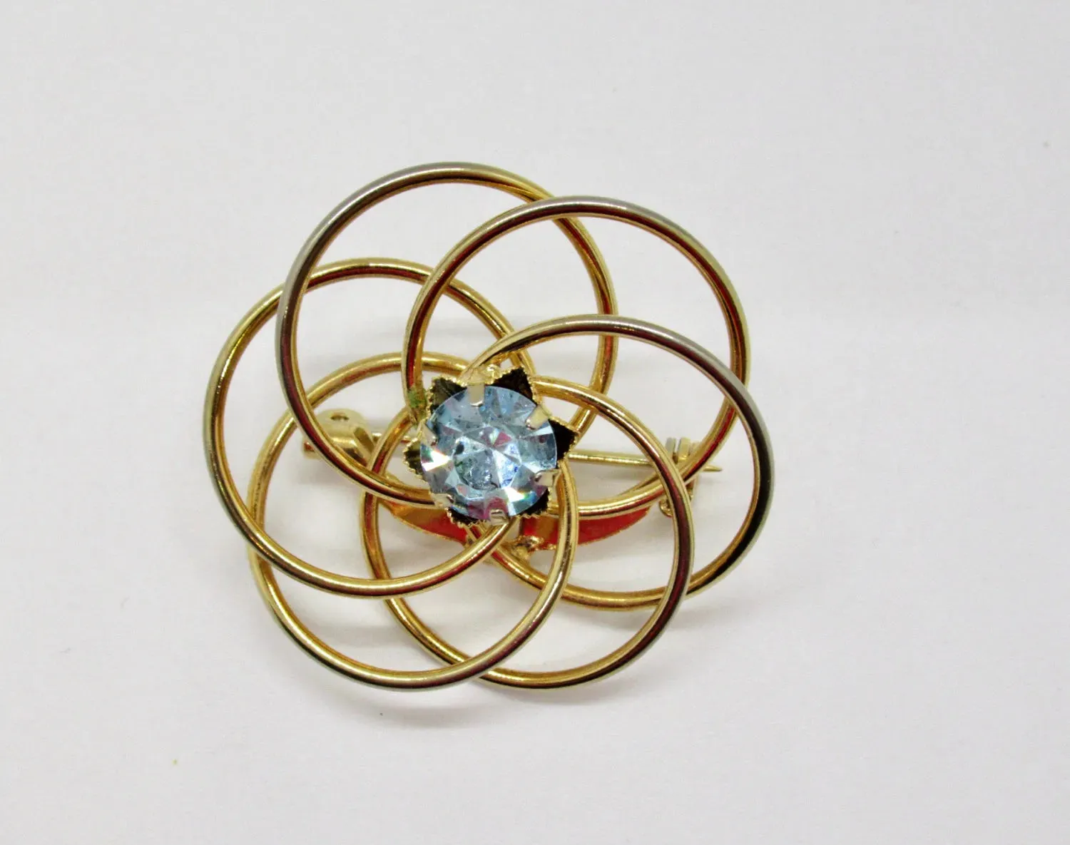 Vintage Swirl Brooch with Blue Rhinestone Center